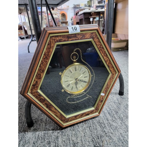 10 - Hexagon shaped framed quartz clock in good order