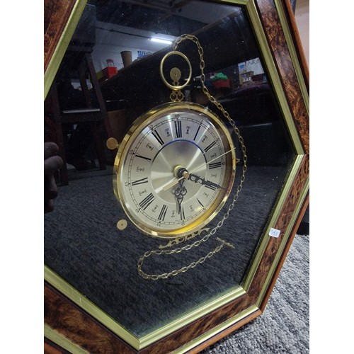 10 - Hexagon shaped framed quartz clock in good order