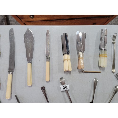 38 - Large quantity of cutlery inc pickle fork, serving spoons, apostle spoons, nut cracker, tea strainer... 