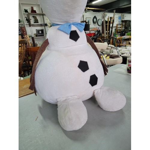 57 - An oversized Olaf off Frozen soft toy in good order measures 102cm high, 50cm wide.