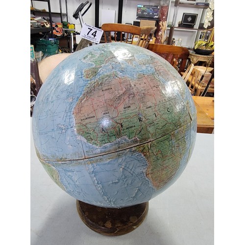 74 - A good quality vintage terrestrial globe standing on a wooden base