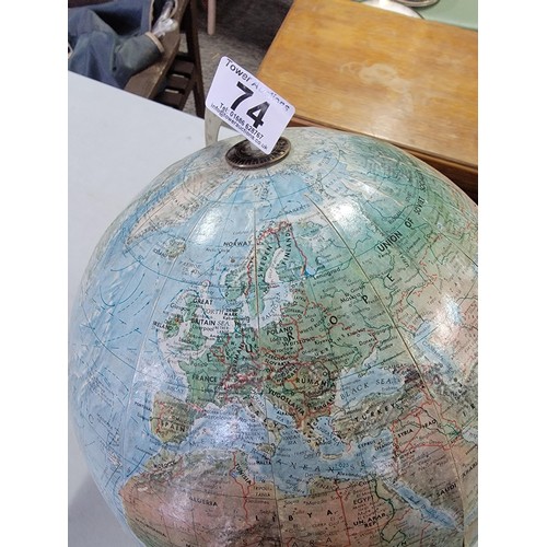 74 - A good quality vintage terrestrial globe standing on a wooden base