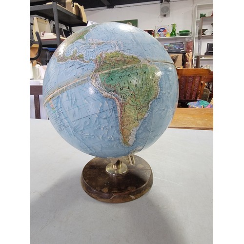 74 - A good quality vintage terrestrial globe standing on a wooden base