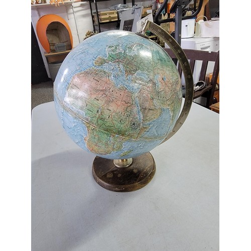 74 - A good quality vintage terrestrial globe standing on a wooden base