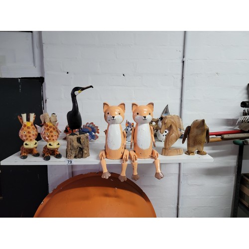 79 - Large quantity of fair trade wooden figures inc foxes, horses head, penguin, giraffe heads, cormoran... 