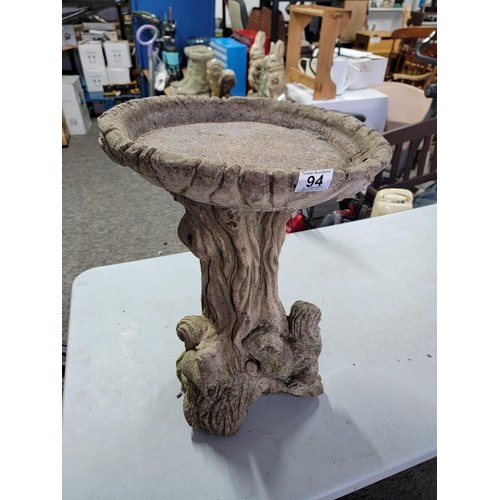 94 - Concrete bird bath with squirrels on a tree stump design to the base in overall good condition heigh... 