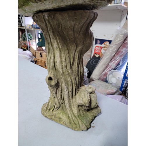 94 - Concrete bird bath with squirrels on a tree stump design to the base in overall good condition heigh... 