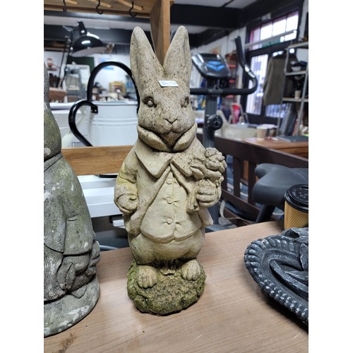 104 - Quantity of 3x stone ware and concrete rabbits, one has damage to one ear, height of tallest 45cm ba... 