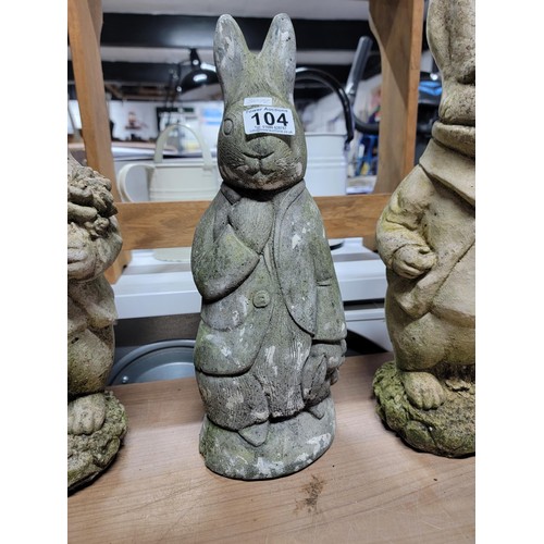 104 - Quantity of 3x stone ware and concrete rabbits, one has damage to one ear, height of tallest 45cm ba... 