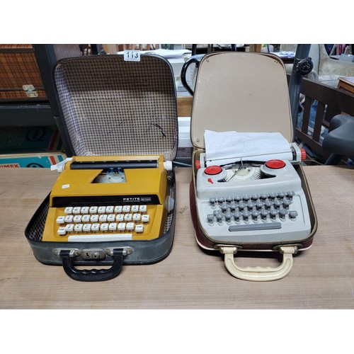 113 - 2x Petite typewriters inc a deulx international model 883924, and a 34080 typewriter