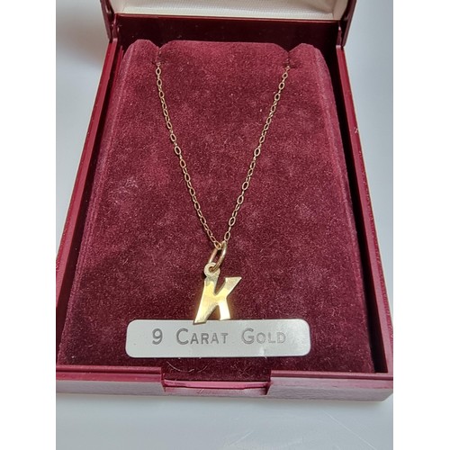 495 - Hallmarked yellow gold necklace with a letter K pendant in clean condition boxed ready.
18