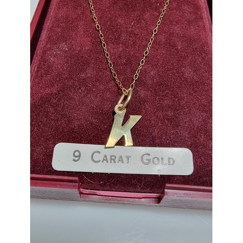 495 - Hallmarked yellow gold necklace with a letter K pendant in clean condition boxed ready.
18