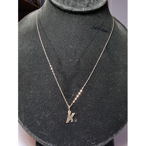 495 - Hallmarked yellow gold necklace with a letter K pendant in clean condition boxed ready.
18