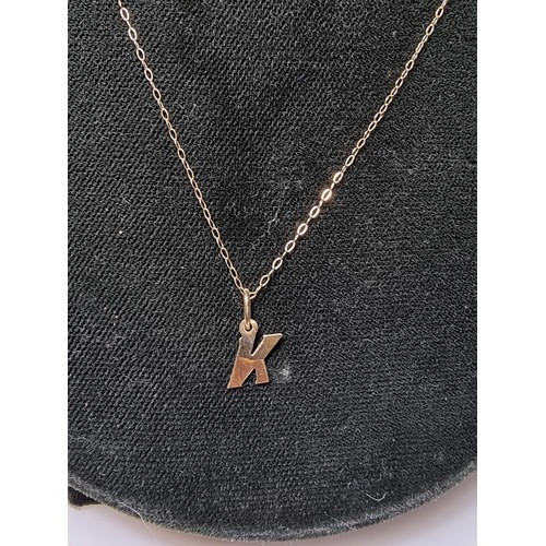 495 - Hallmarked yellow gold necklace with a letter K pendant in clean condition boxed ready.
18