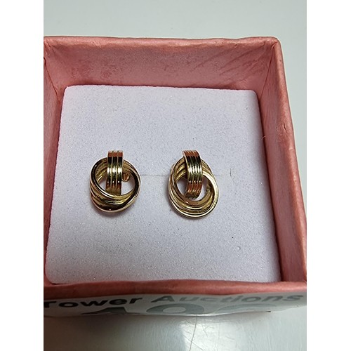 496 - Pair of 9ct yellow gold stud earrings with an ornate twist design in good clean boxed condition weig... 