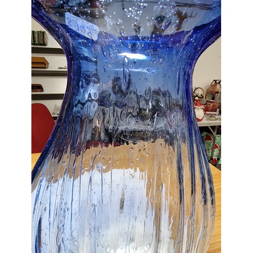 499 - Two large impressive art glass vases to inc. a hand made/blown vase with a ribbed design showing bub... 