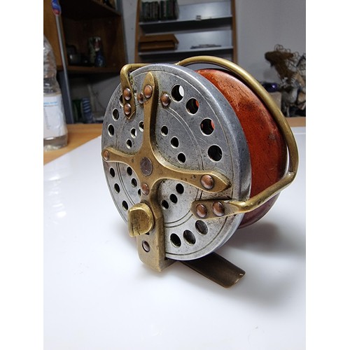 502 - Good quality antique star back fishing reel of hardwood with brass in great clean condition displays... 