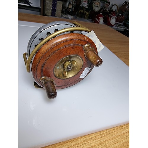 502 - Good quality antique star back fishing reel of hardwood with brass in great clean condition displays... 