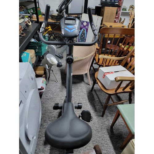 198 - Roger black exercise bike in working order with fully working digital screen has a tension control, ... 