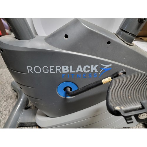 198 - Roger black exercise bike in working order with fully working digital screen has a tension control, ... 