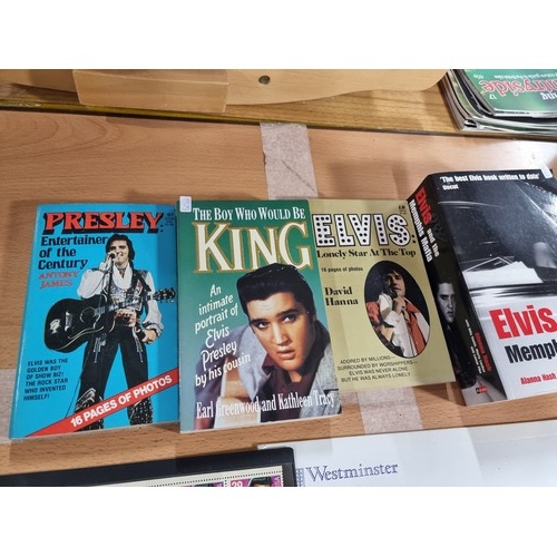 5 - A lot relating to Elvis to include 4 books, a DVD, A full sheet of Elvis stamps and a LIFE magazine.