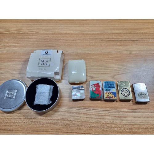 6 - A collection of 6 vintage lighters to include a new old stock Silk Cut cased lighter with its origin... 