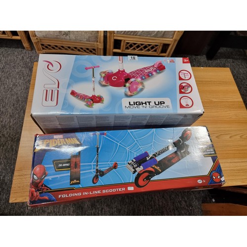 10 - A boxed Spiderman folding scooter along with a boxed EVO light up move and groove child's scooter, b... 