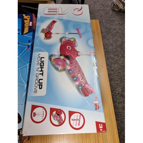 10 - A boxed Spiderman folding scooter along with a boxed EVO light up move and groove child's scooter, b... 