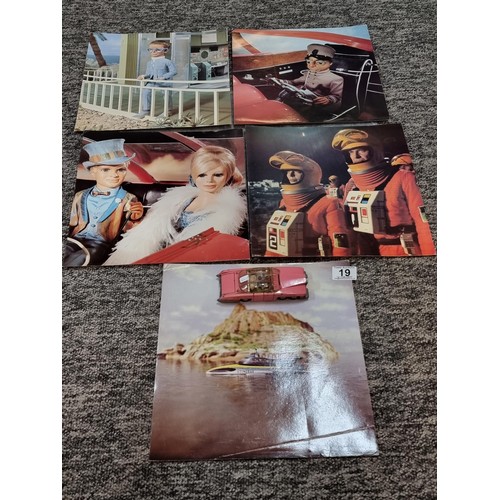 19 - A collection of 5x large vintage photographs relating to Thunderbirds along with a Dinky toys Lady P... 