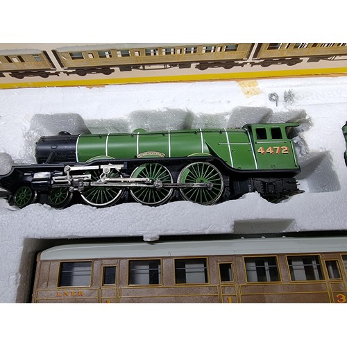 20 - A boxed Hornby R1019 Flying Scotsman 3 coach train set, complete with track mat and in very clean ha... 