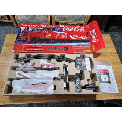 31 - A brand new and boxed Hornby R1233M Coca Cola Christmas train set, never had any use or been unpacka... 