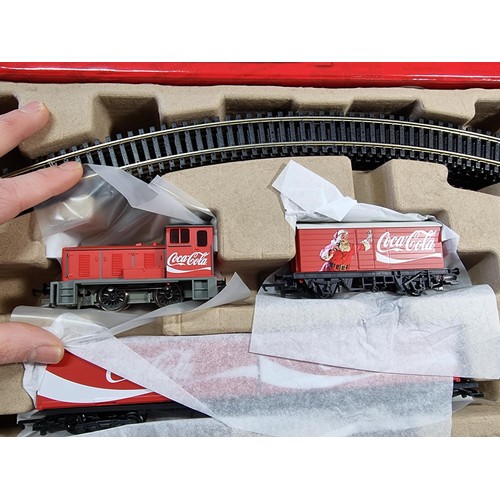 31 - A brand new and boxed Hornby R1233M Coca Cola Christmas train set, never had any use or been unpacka... 