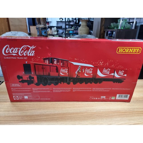 31 - A brand new and boxed Hornby R1233M Coca Cola Christmas train set, never had any use or been unpacka... 