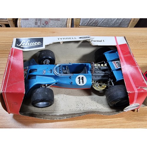 46 - 4x rare vintage model cars to include a boxed Schuco Tyrell Ford Formular1 car, a Marx toys sparklin... 