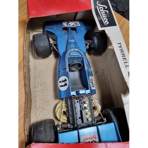 46 - 4x rare vintage model cars to include a boxed Schuco Tyrell Ford Formular1 car, a Marx toys sparklin... 