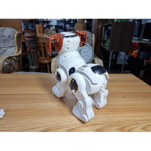 49 - A vintage Manley Toy Quest Tekno The Robotic Dog with remote control and 2 toys, in excellent workin... 