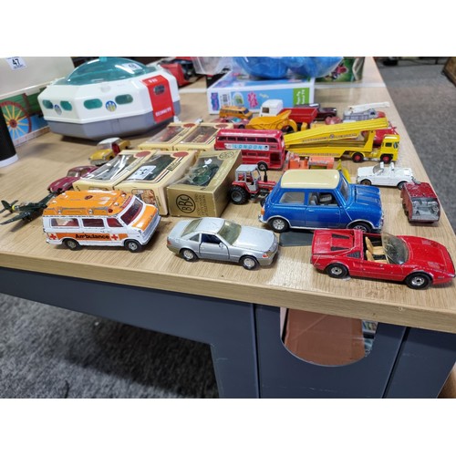 54 - A large collection of approx 29 diecast model cars to include Porsche, Ferrari, Tractor, etc, by var... 