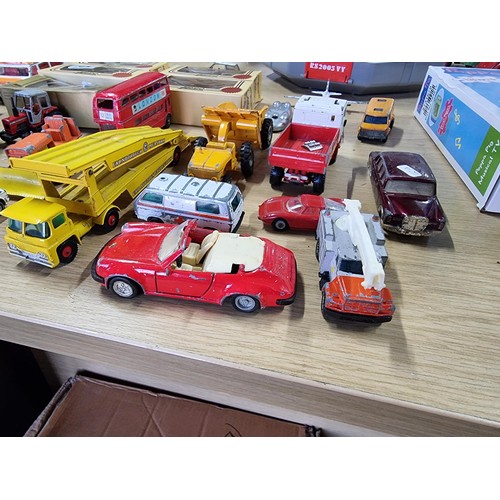 54 - A large collection of approx 29 diecast model cars to include Porsche, Ferrari, Tractor, etc, by var... 