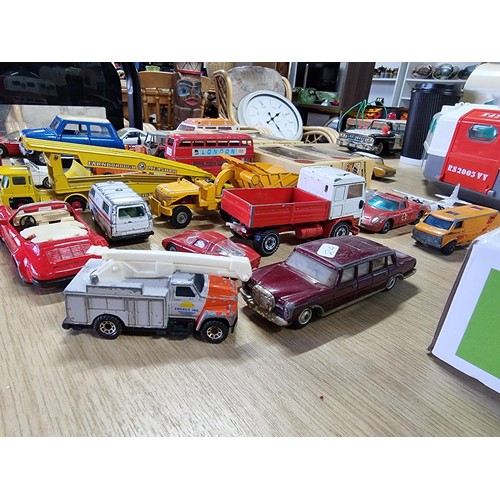 54 - A large collection of approx 29 diecast model cars to include Porsche, Ferrari, Tractor, etc, by var... 