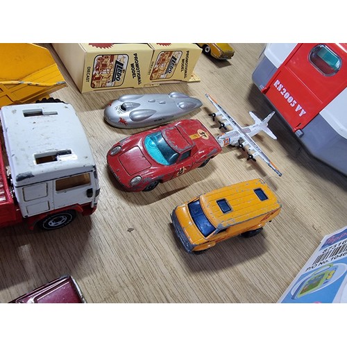 54 - A large collection of approx 29 diecast model cars to include Porsche, Ferrari, Tractor, etc, by var... 