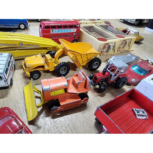 54 - A large collection of approx 29 diecast model cars to include Porsche, Ferrari, Tractor, etc, by var... 