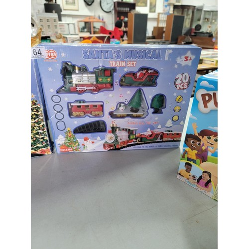 64 - 2x boxed train sets inc Santa's musical train set No.3388 along with one other train set, also inclu... 