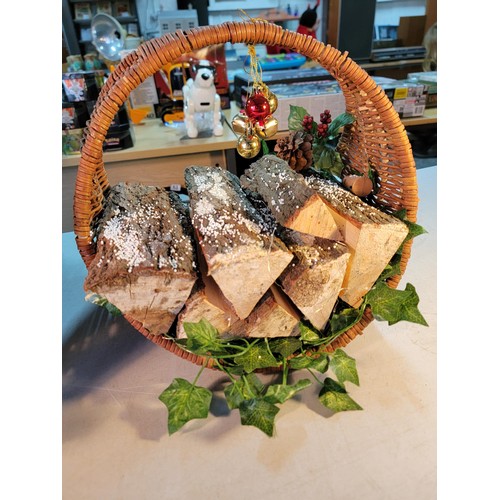 67 - 2x wicker log baskets full of real logs, with bauble and ivy decorations both in good order