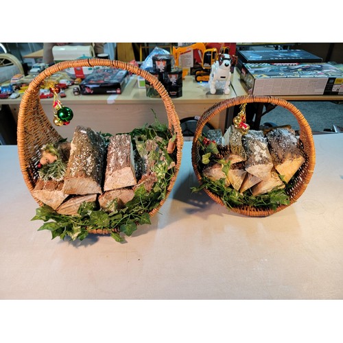 67 - 2x wicker log baskets full of real logs, with bauble and ivy decorations both in good order