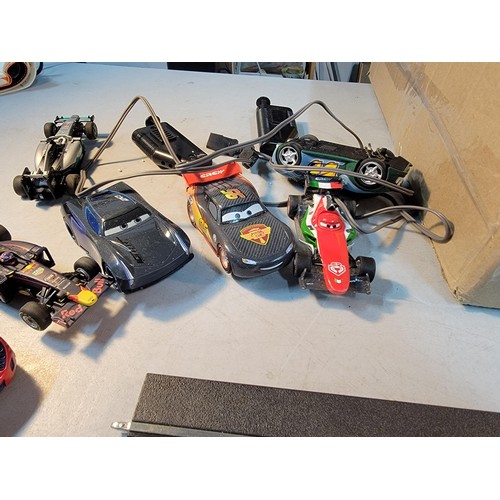 69 - Box containing a quantity of Carrera race track with cars and controllers with accessories