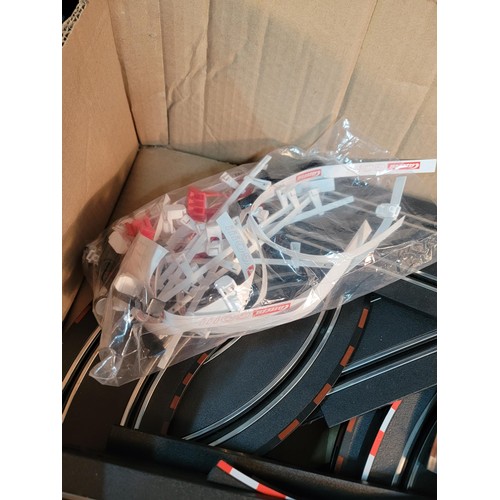 69 - Box containing a quantity of Carrera race track with cars and controllers with accessories