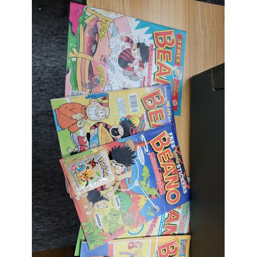 88 - Large job lot of Beano comics all stored correctly and many include original gifts still attached. I... 