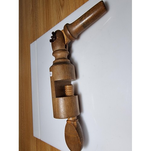 136 - A good vintage solid wood nutcracker with adjustable handle. Has a length of 35cm, in good condition... 