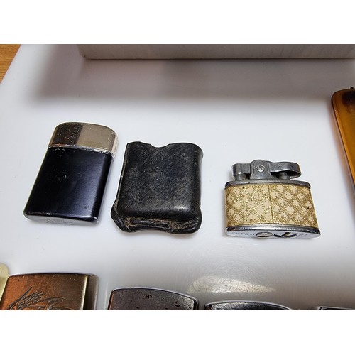 138 - A collection of 8x various collectable lighters along with a faux tortoise shell cigarette case, all... 