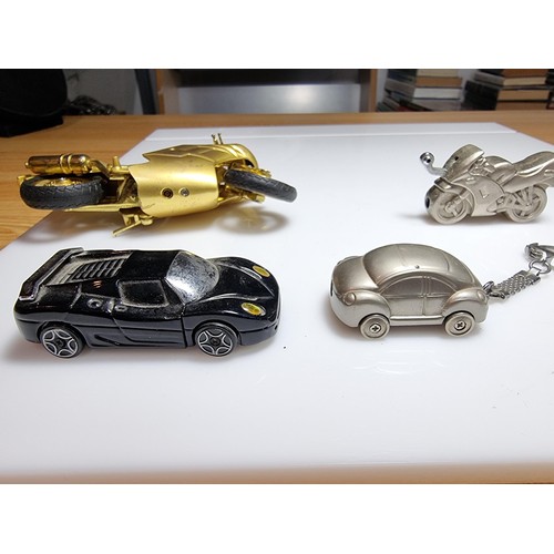 141 - A collection of 5x novelty collectable lighters in the form of motorcycles and cars to include a lar... 